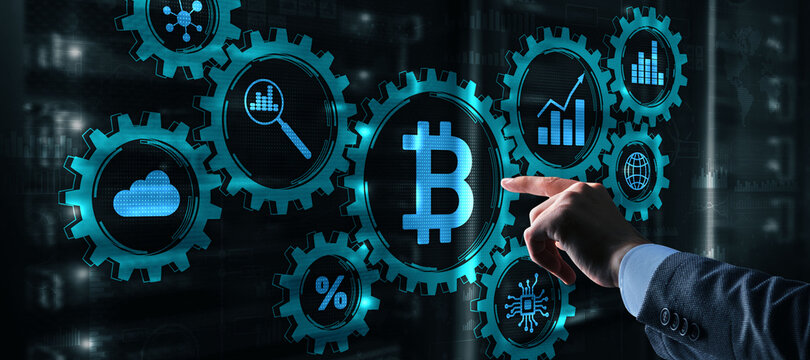 Hand clicks on virtual display with bitcoin cryptocurrency image. Gear mechanisms