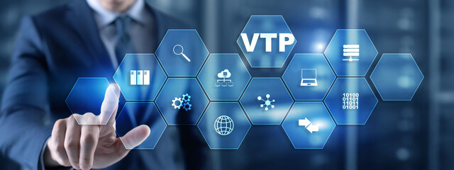 The man clicks on the inscription VTP. VLAN Trunking Protocol. Virtual Local Area Network