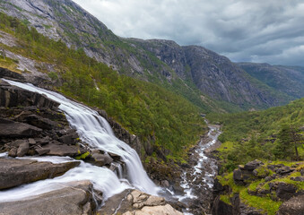 Fototapeta na wymiar Breathtaking scenery and four majestic waterfalls in Husedalen from Kinsarvik to the Hardangervidda mountain plateau, Norway