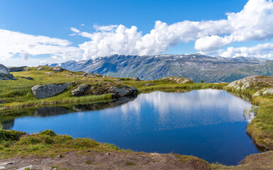 Fototapeta na wymiar Hiking the famous Dronningstien (the Queen’s route) from, Kinsarvik, the Hardangervidda National Park and Lofthus, Hardanger, Norway.