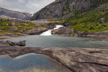 Breathtaking scenery and four majestic waterfalls in Husedalen from Kinsarvik to the Hardangervidda mountain plateau, Norway