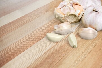 Garlic bulbs on the desk. Organic food background.