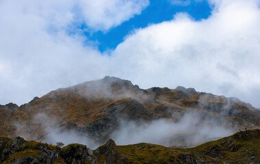 Fog clouds on a mountain slope
