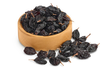 Yellow raisins in wooden bowl isolated on white background with clipping path and full depth of field