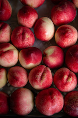 Beautiful ripe peaches and nectarines on the market counter. Great fruit background.