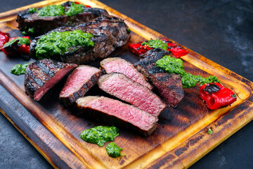 Traditional barbecue dry aged wagyu Brazilian picanha beef steaks served with chili and chimichurri...