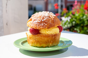 Tarte tropezienne or La Tarte de Saint-Tropez - dessert pastry consisting of filled brioche with cream and fresh berries.