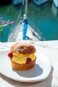 Tarte tropezienne or La Tarte de Saint-Tropez - dessert pastry consisting of filled brioche with cream and fresh berries.