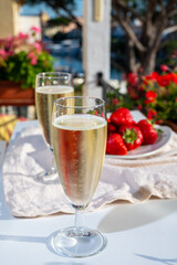 Summer party, pouring of French champagne sparkling wine in glasses in yacht harbour of Port Grimaud near Saint-Tropez, French Riviera vacation, France