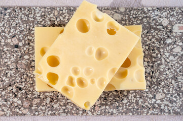 Cheese collection, semi-hard French cheese emmentaler with round holes made from cow milk