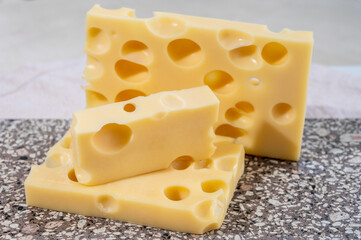 Cheese collection, semi-hard French cheese emmentaler with round holes made from cow milk