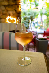 Summer on French Riviera Cote d'Azur, drinking cold rose from Cotes de Provence on outdoor terrase in old cafe, Var, France