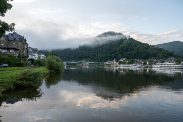 View on Mosel river, hills with vineyards and old town Traben-Trarbach, Germany