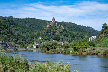 Fototapeta na wymiar View on Mosel river, hills with vineyards and castle in old town Cochem, Germany, Germany
