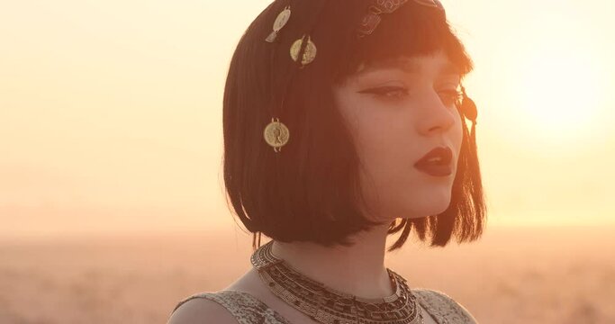 portrait of attractive charming girl with beautiful makeup. girl looks like a cleopatra