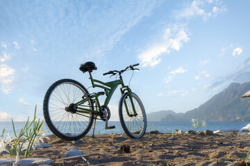 Fototapeta na wymiar Bicycle on the beach. Cirali, Antalya, Turkey.