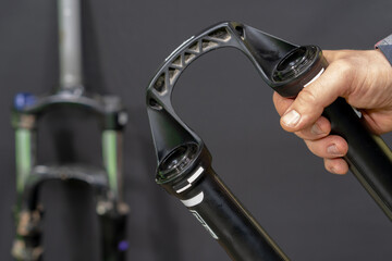 Repair of modern mountain bikes and shock-absorbing forks in a professional workshop. Parts of the...
