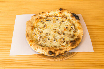 One-person tartufata pizza with confit mushroom shake, sunflower oil, capers, anchovies, black olive meat, black truffle and garlic
