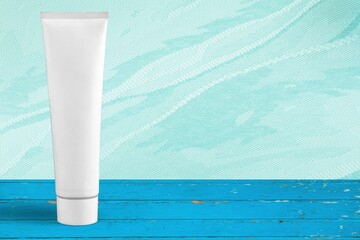 Blank label facial cleanser skincare white tube bottle on the desk