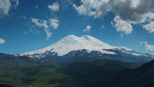 Beautiful view of Mount Elbrus and clouds, North Caucasus mountains, Russia, timelapse 4k