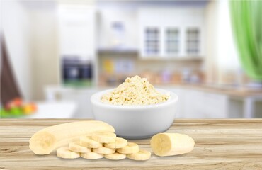 Tasty bananas fruit and flour on the desk