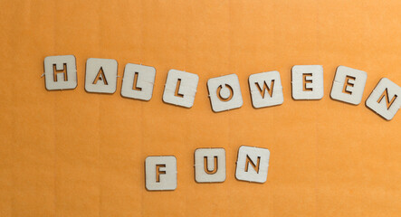 laser-cut halloween themed wooden shapes on a paper background - the message 