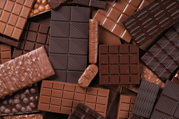 milk and dark chocolate bar, dessert food background.