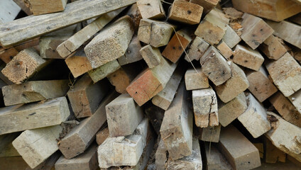 the pile of the construction wood. the chopped wood for construction, and wooden furniture. a versatile lumber for many needs.