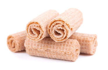 Crispy wafer rolls isolated on white background. Cinnamon flavored waffle.