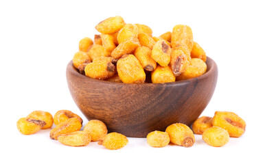 Roasted salted corn nuts in wooden bowl, isolated on white background. Beer snack, dry corn with spices.