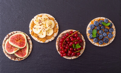 Rice cake with banana  blueberry redcurrant and figs