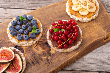 Rice cake with banana  blueberry redcurrant and figs