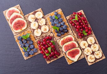 Crispbread with banana  blueberry redcurrant and figs