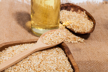 sesamum indicum - dried white sesame seeds on white background