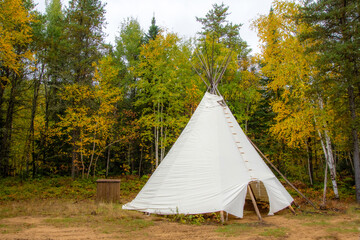 native teepee in canadian forest at fall © Gilles Rivest