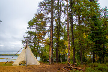 native teepee in canadian forest at fall © Gilles Rivest