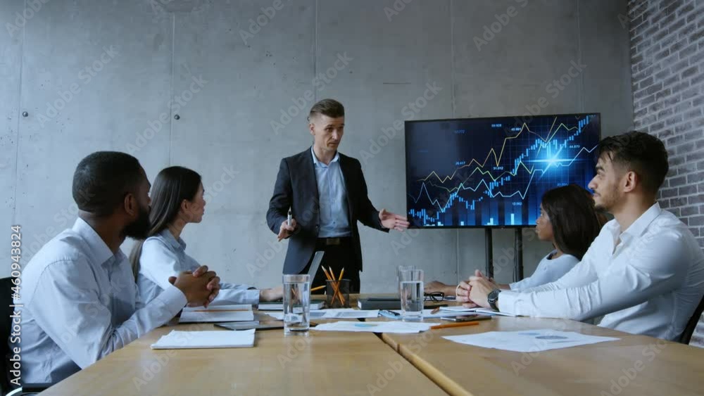 Poster financial director making presentation to group of diverse coworkers with help of graphs on digital 