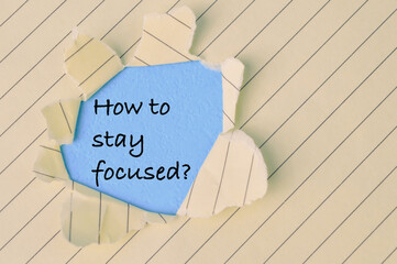 Torn paper written with question HOW TO STAY FOCUSED?