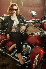 Fototapeta na wymiar redhead biker girl