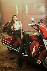 Fototapeta na wymiar biker girl on her motorcycle