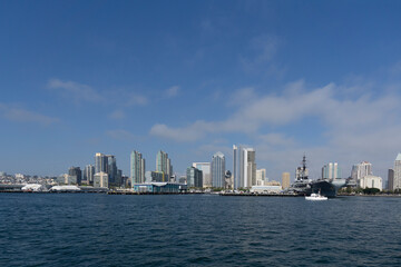 Fototapeta na wymiar View of skyline and USS Midway aircraft carrier in downtown San Diego California