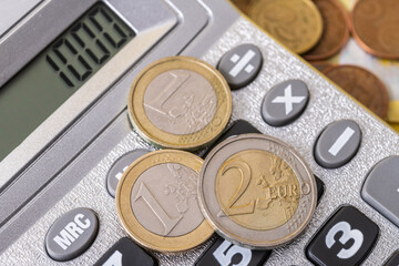 Euro coins and calculator