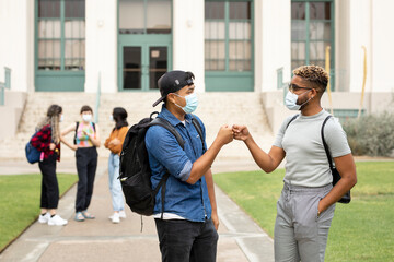 Fist bump at campus in the new normal