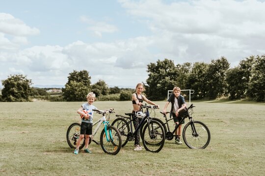 Summer hobby background, kids on bikes, family photos