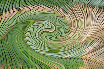 Wonderful green and brown twirl pattern of leaves top view