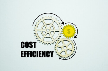 A picture of wooden and illustration of money gear and cost effeciency word. Cost efficiency is saving money by improving a process or product.
