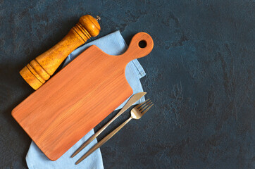 empty cutting board for copy space text and mock up and silver table utensil fork and knife flat...