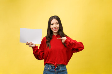 Fototapeta na wymiar Asian young woman holding blank board or paper