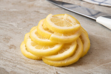 Lemon slices stacked on a kitchen counter