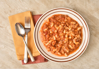 Bowl of macaroni and beef overhead view